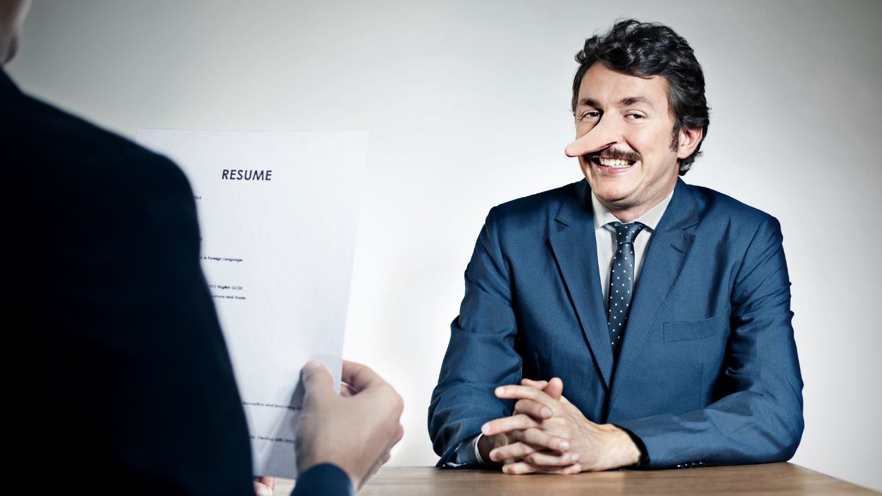 Man interviewing for job with long nose